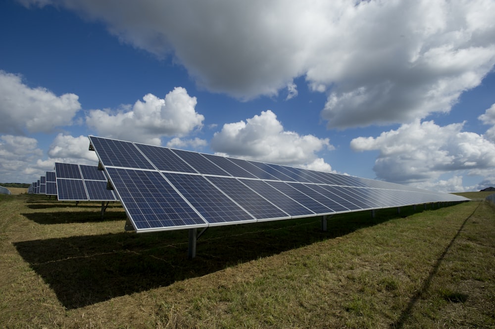 Solar panel installation under a bright sky
